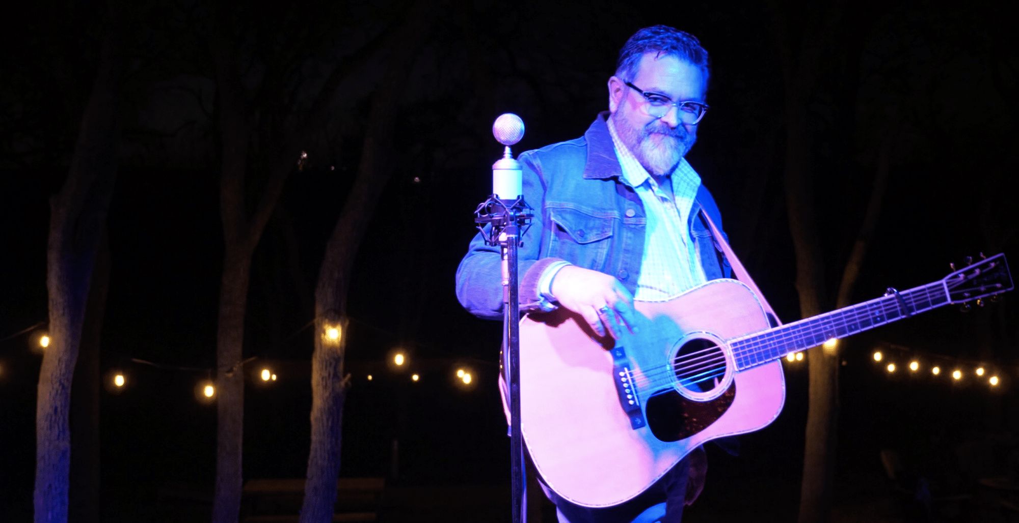 Dan Gonzalez on stage with his guitar